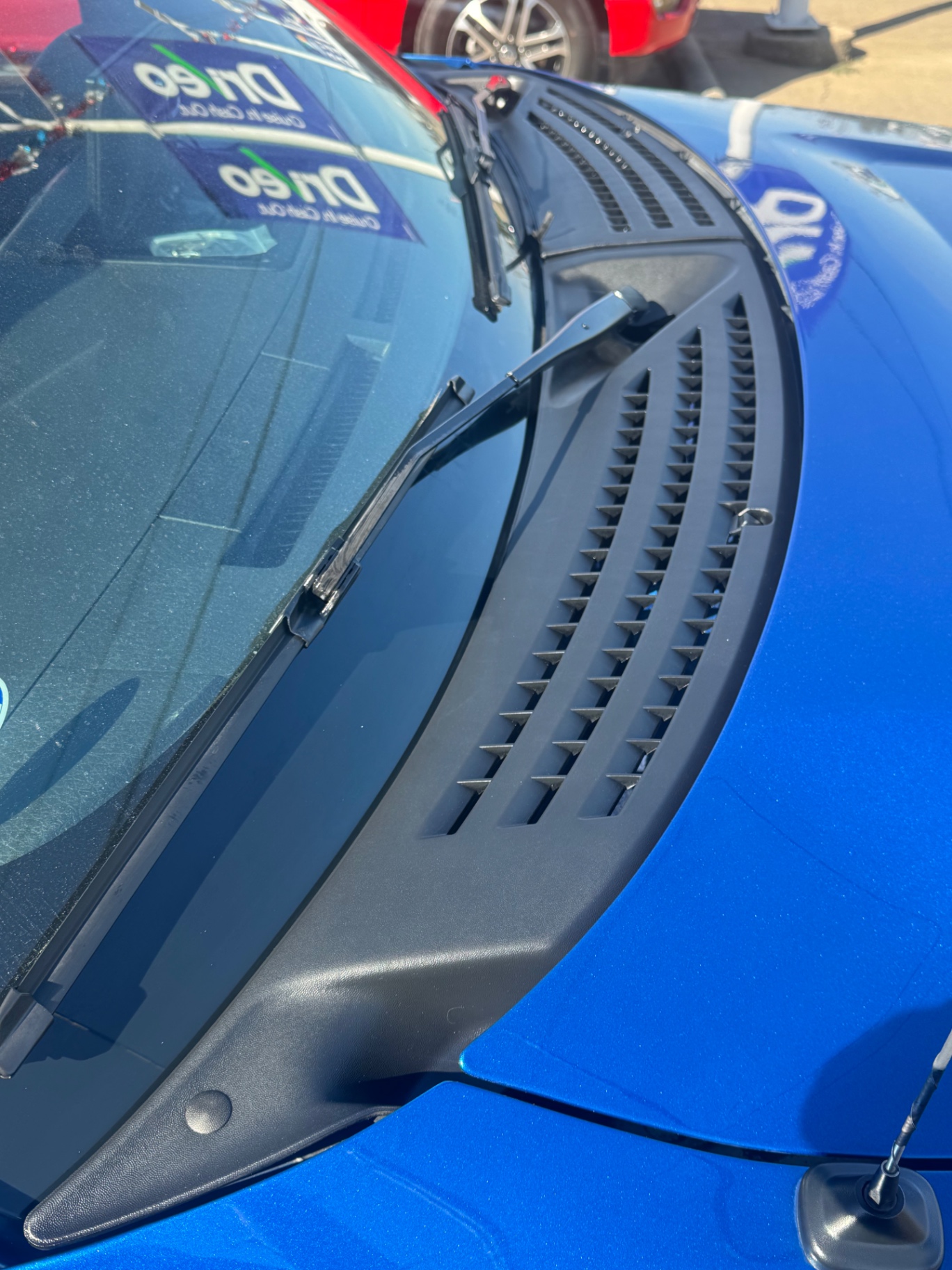 After photo of cowl panel and wiper arms restored to factory matte black